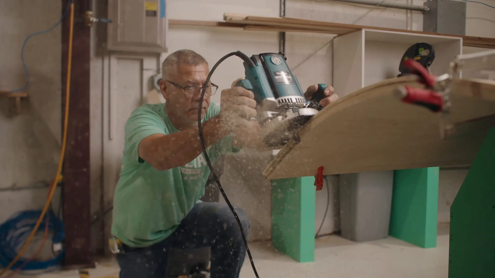 Dovetail craftsman routing a curved wood panel