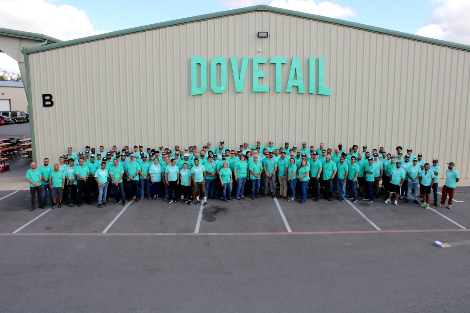 The Dovetail crew in front of the Dovetail building in Del Valle, Texas