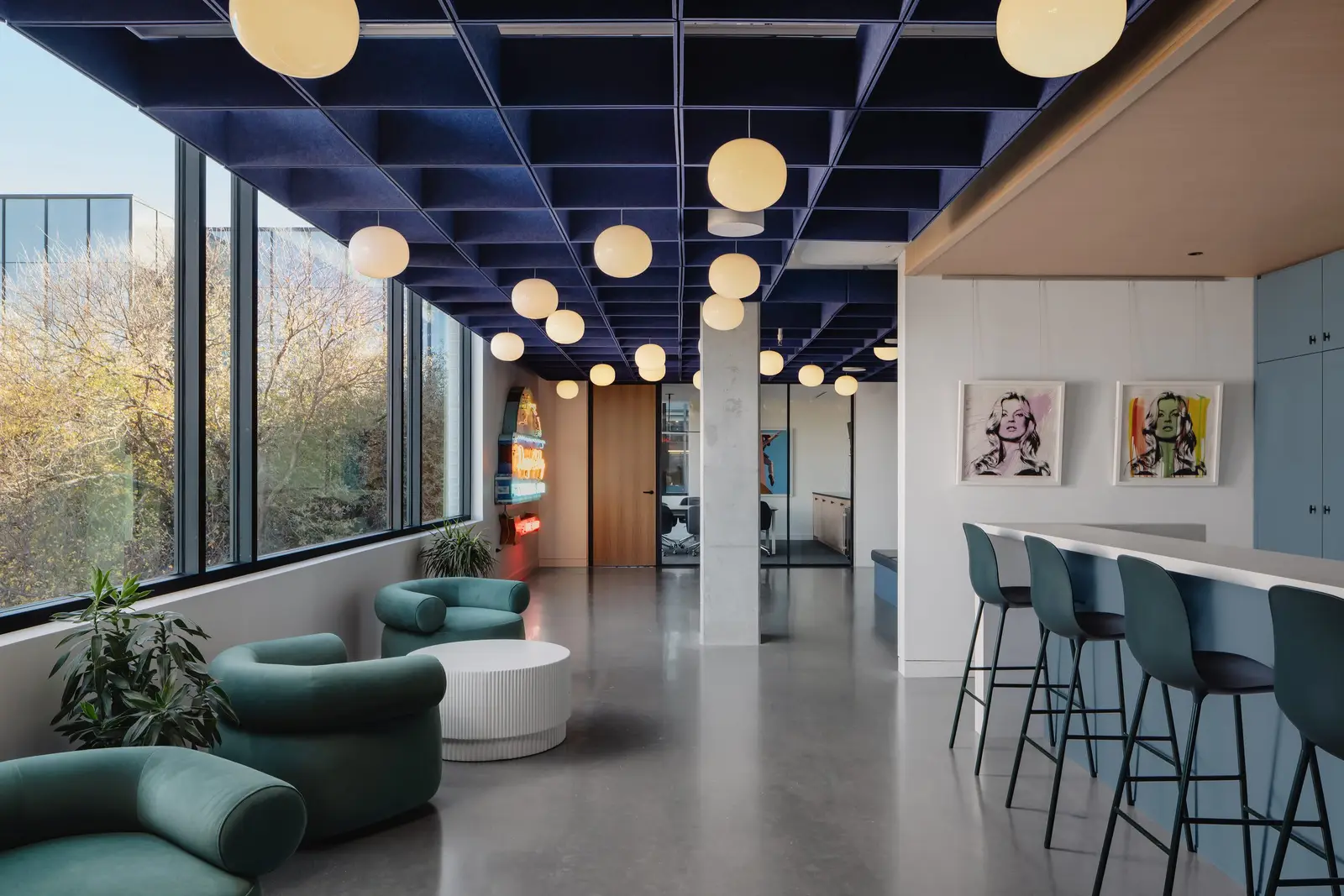 Atmosphere TV hallway with a blue grid ceiling, round lights and counter seating