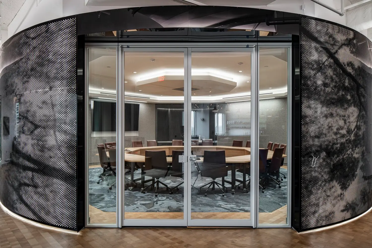 Boston Consulting Group round conference room with glass doors and curved patterned walls