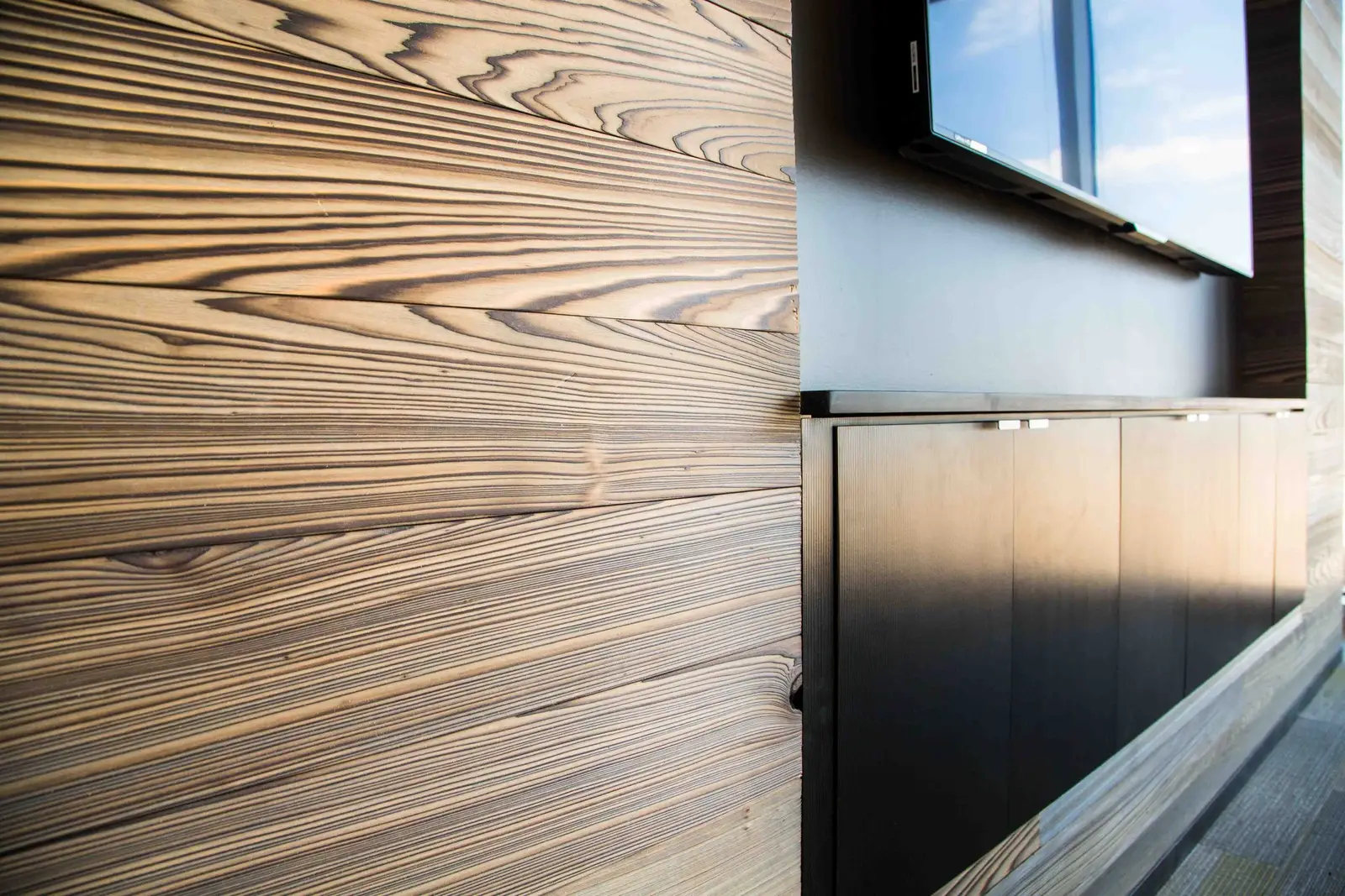 Boka Powell textured wood wall panel beside a TV niche