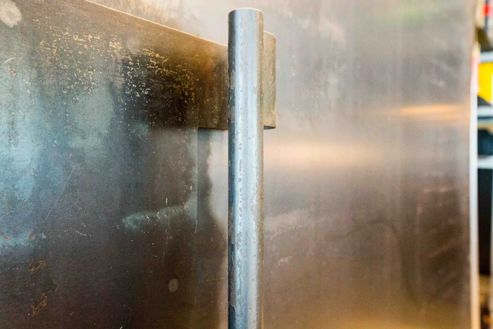 Boka Powell metal-finished sliding door with a round metal pull, close view