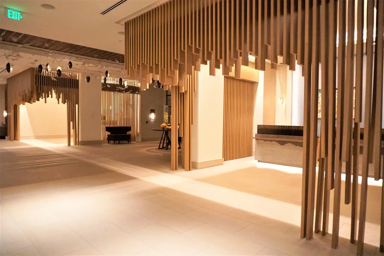 Four Seasons Hotel lobby with a hanging wood slat canopy over the entry