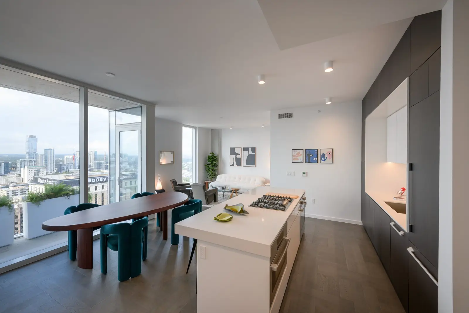 Linden Residences kitchen and dining area with window views and a dark cabinet wall
