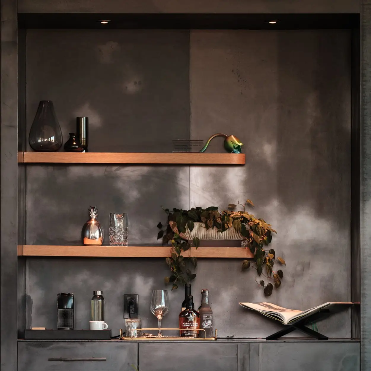Loren Hotel recessed niche with wood shelves on a dark wall