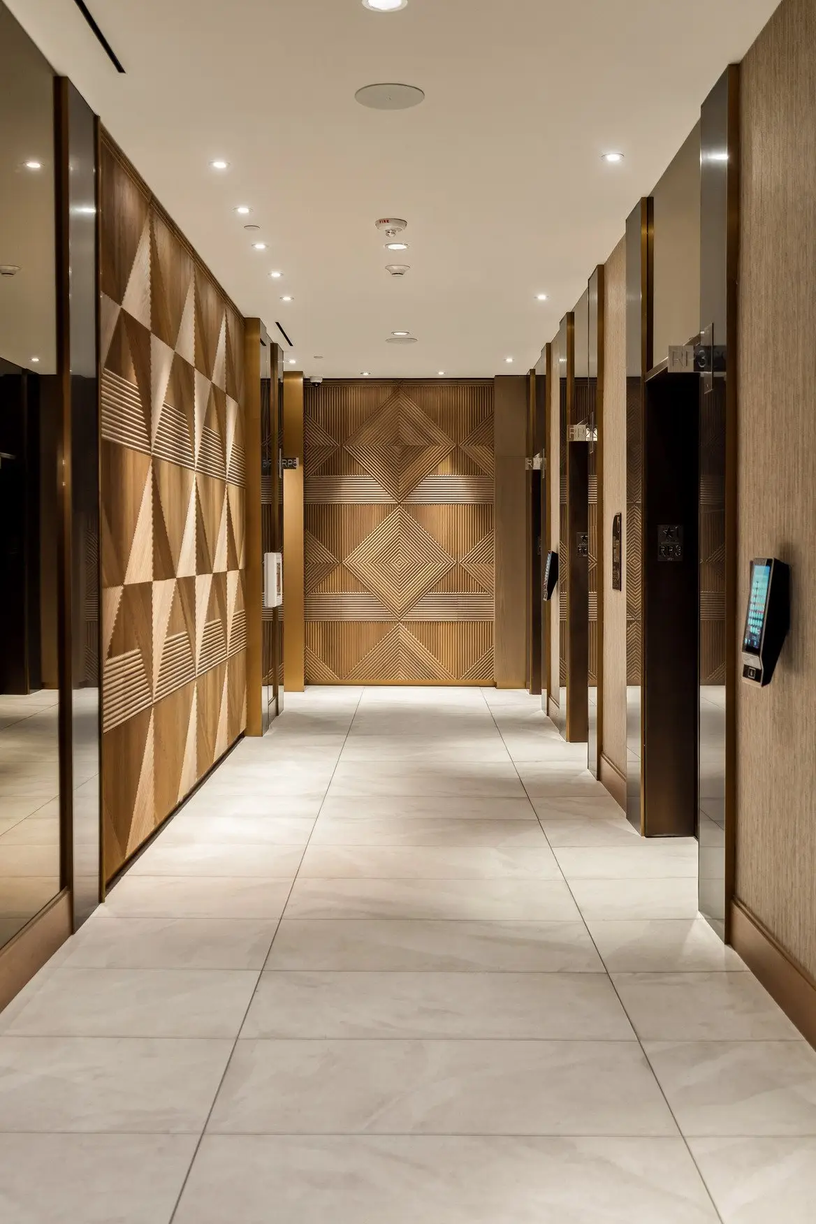 Sixth and Guadalupe elevator corridor with geometric wood wall panels