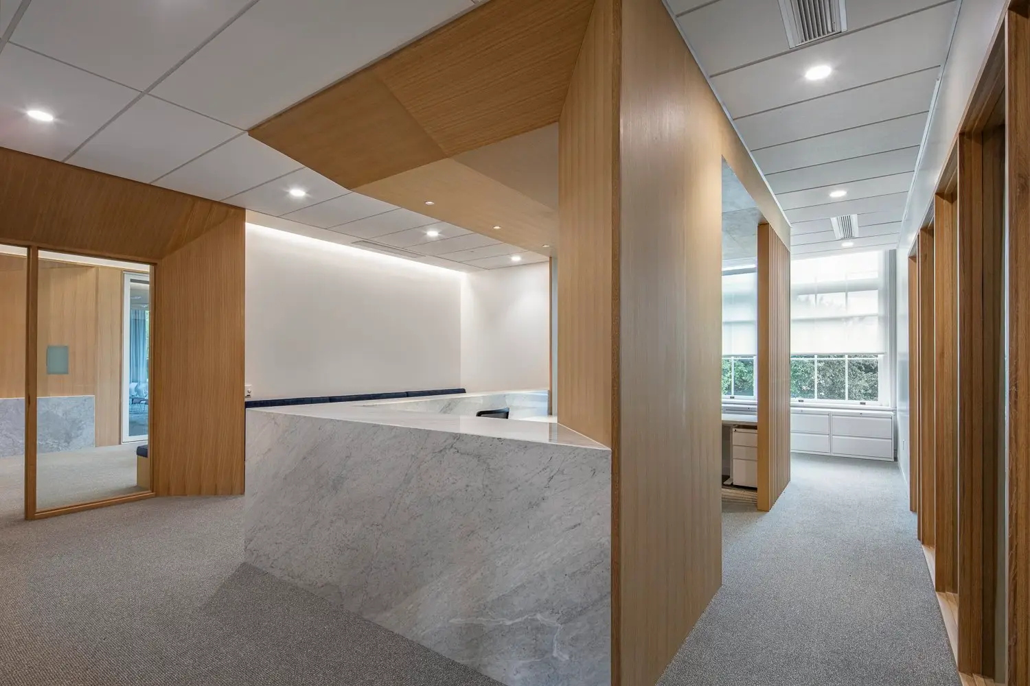St. Edward's University stone reception counter inside a wood frame