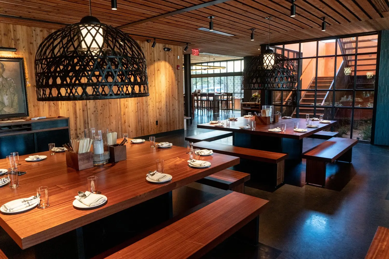 Sway Bee Caves dining table with benches under a large woven pendant light