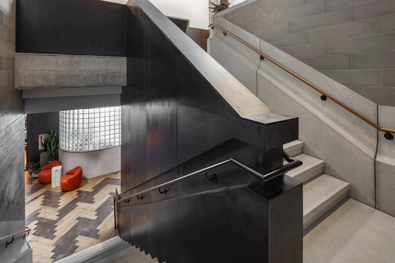 Thompson Hotel stair with a black metal wall and handrail