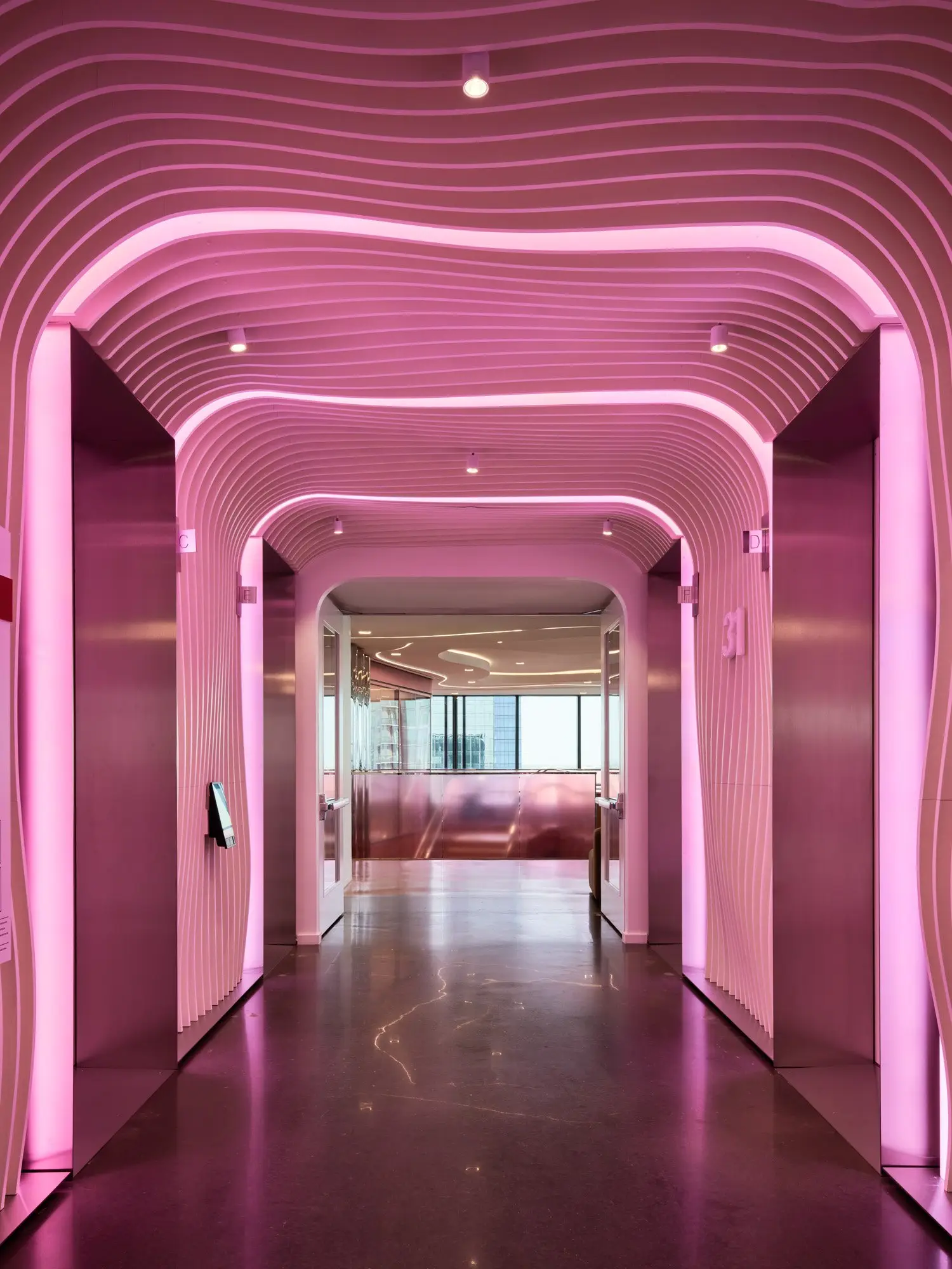 TikTok pink-lit corridor with a wavy ribbed ceiling