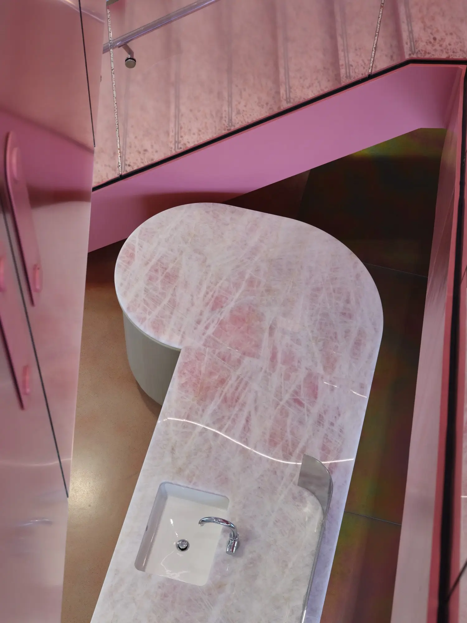 TikTok pink stone counter with an inset sink seen from above