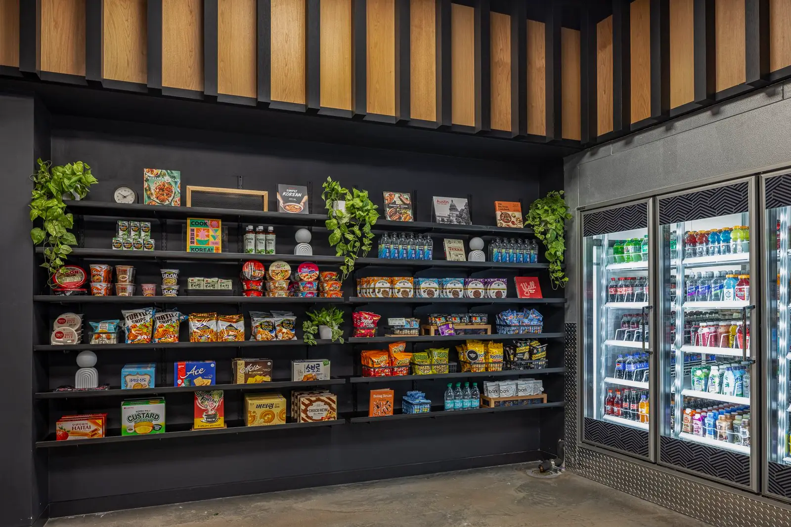 Undisclosed Project market shelving and refrigerators below a wood slat ceiling feature