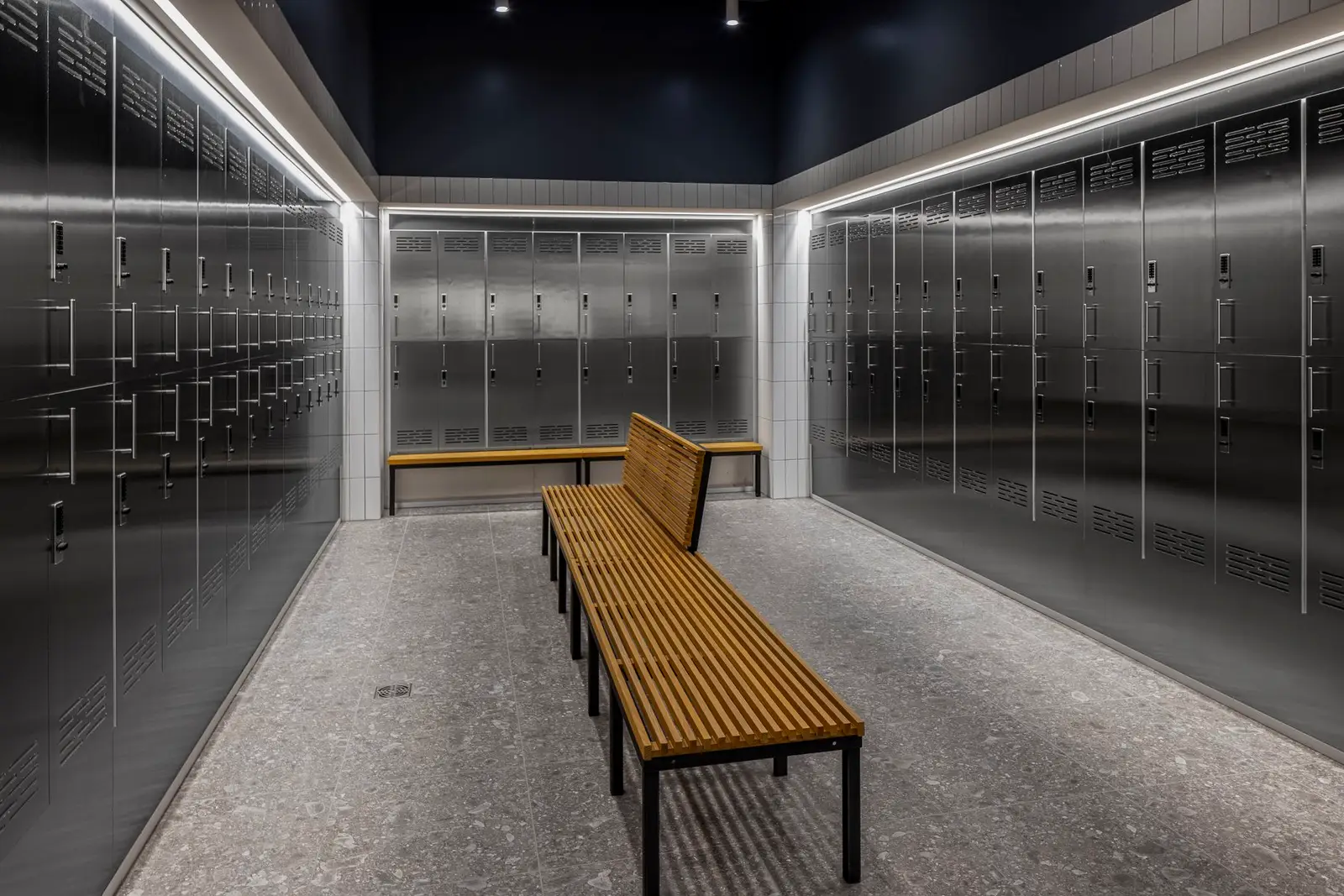 Undisclosed Project locker room with metal lockers and a wood slat bench