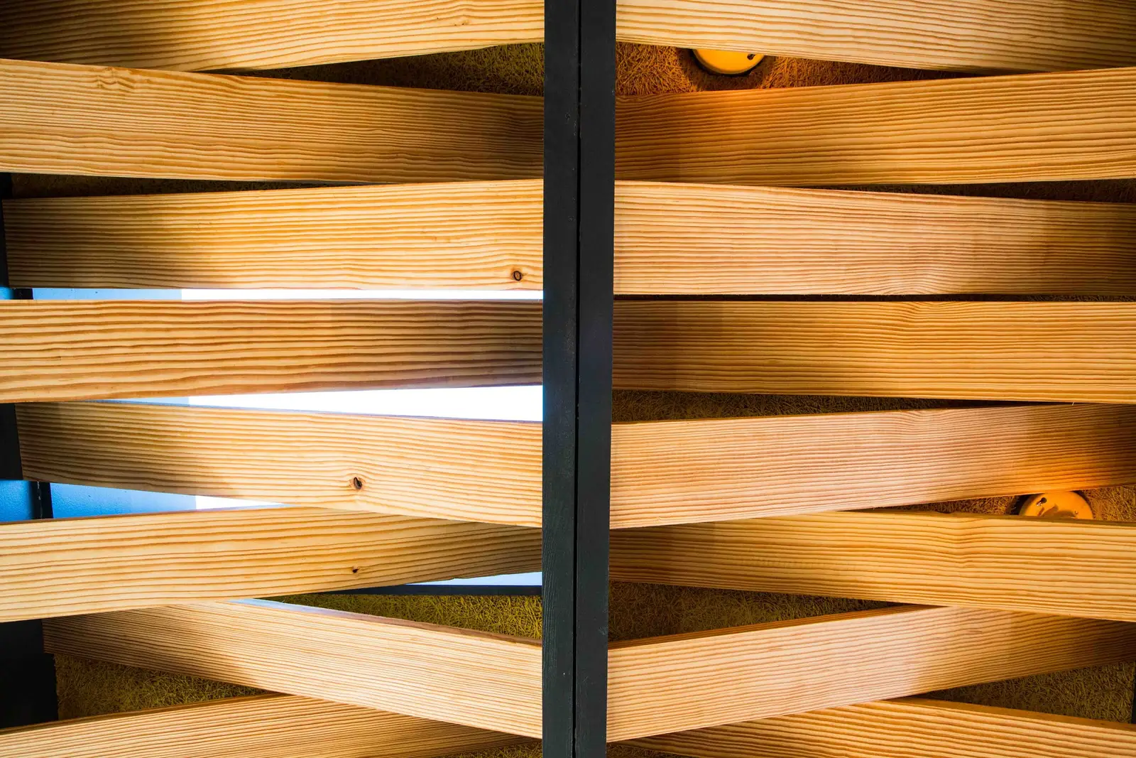 Unit-D Pizzaria close view of interlaced wood slats