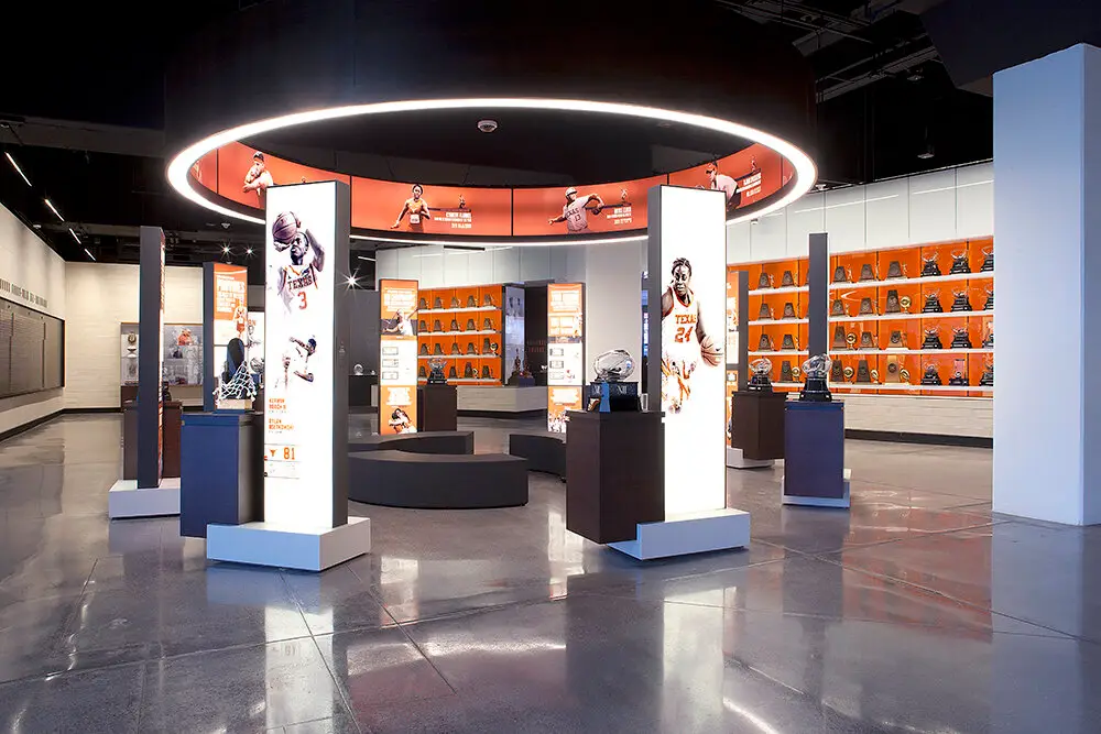 University of Texas Hall of Fame exhibit hall with a ring light above illuminated display towers