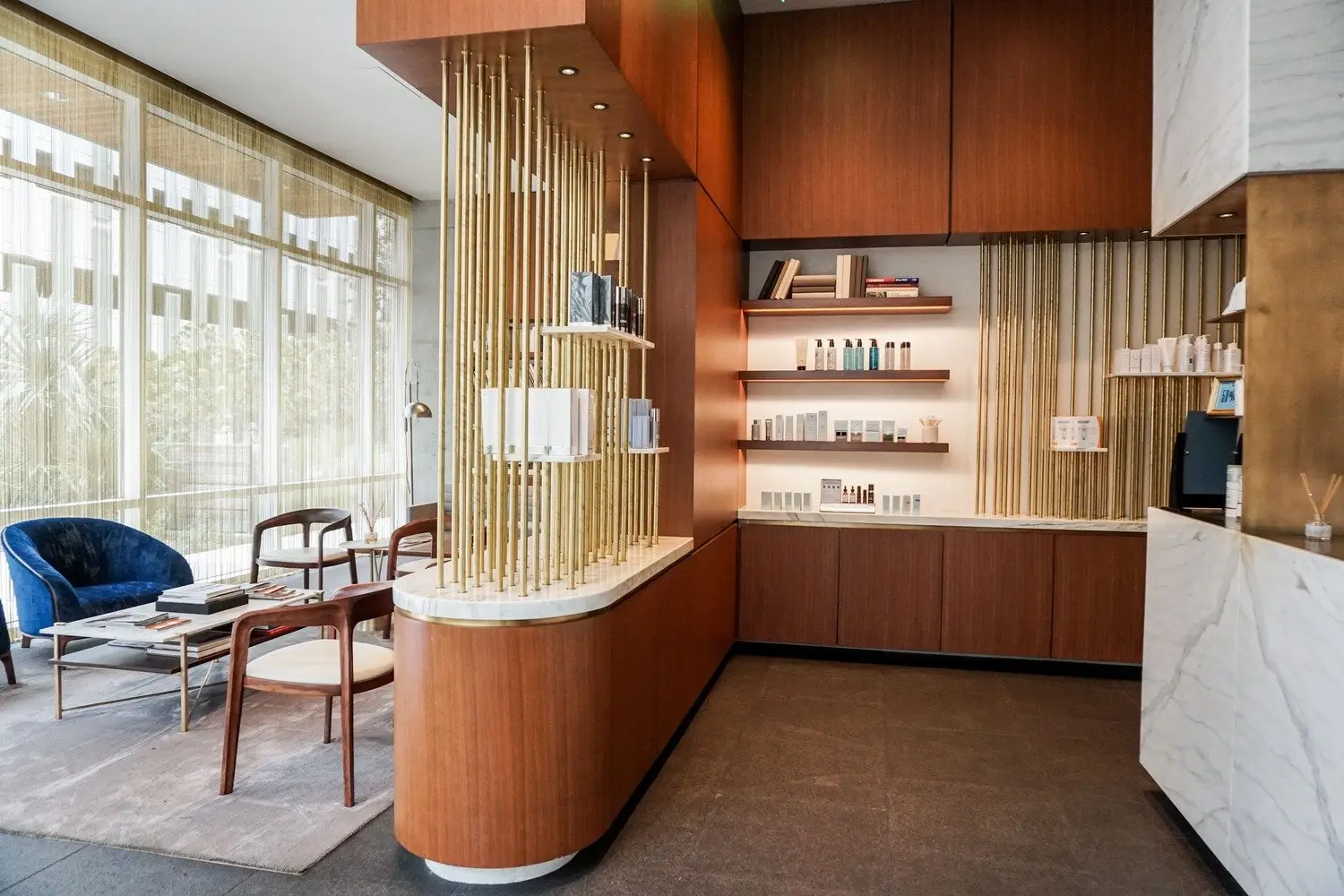 Westlake Dermatology curved wood cabinet with a gold slat divider and shelving